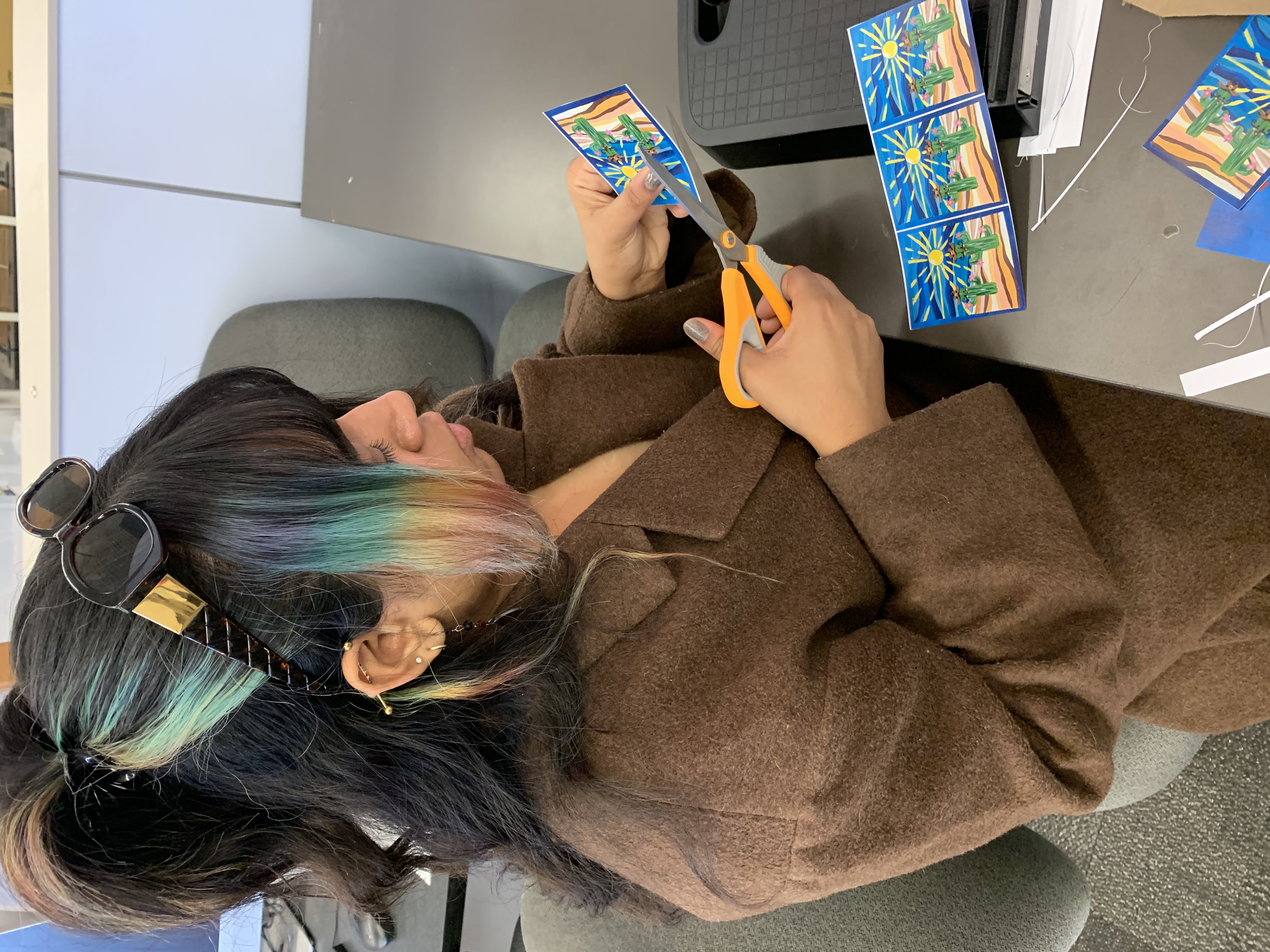 Sinthia cutting prints by hand at Choonie